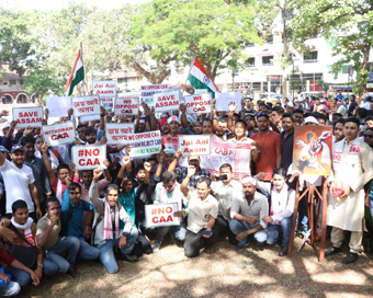  Panaji: Assamese, both settled and employed in Goa, stage a peaceful protest to demand withdrawal of the Citizenship Amendment Act (CAA) 2019 at the Azad Mandan Square in Panaji on Dec 21, 2019. (Photo: IANS)