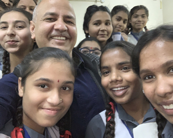 Delhi Education Minister Manish Sisodia with school kids