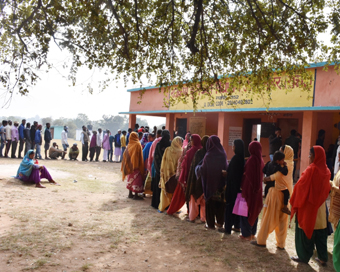  Khunti: People queue up outside a polling station to cast their votes for the second phase of Jharkhand Assembly elections, in Khunti on Dec 7, 2019. (Photo: IANS)